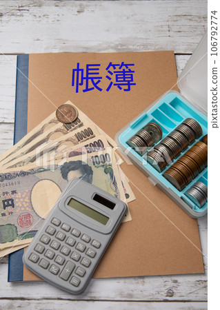 Image of accounting ledger, cash and calculator 106792774
