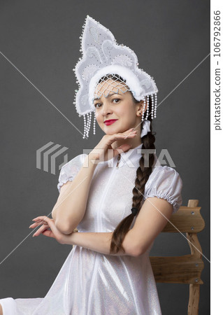 Snow Maiden. Winter portrait of a beautiful young woman in a winter crown. Snow Maiden. Winter portrait of a beautiful young woman in a winter crown. 106792866
