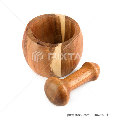Wooden pestle and mortar isolated on a white . Wooden pestle and mortar isolated on a white . 106792912