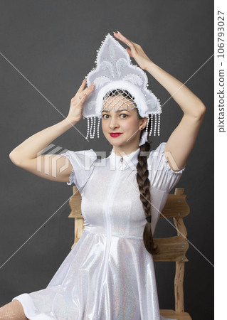 Snow Maiden. Winter portrait of a beautiful young woman in a winter crown. 106793027