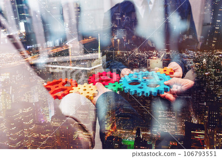 Business team work together and combine pieces of gears. Partnership and integration concept 106793551