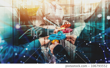 Business team work together and combine pieces of gears. Partnership and integration concept Business team work together and combine pieces of gears. Partnership and integration concept 106793552