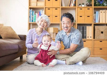 Grandparents and grandchildren together smiling Grandparents and grandchildren together smiling 106794409