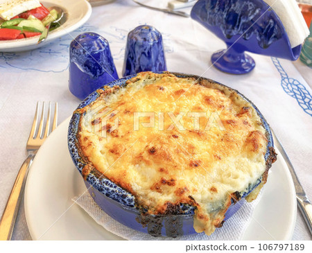 traditional greek moussaka cooked in a casserole in Greece traditional greek moussaka cooked in a casserole in Greece 106797189
