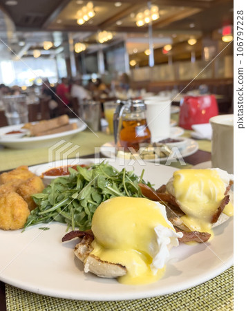 breakfast table with egg Benedict plate 106797228
