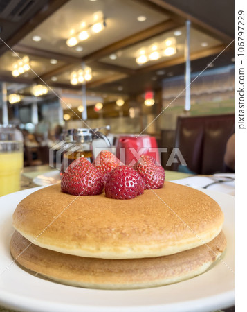 stack of pancakes with strawberry 106797229