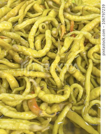 top view pickled hot peppers as a background top view pickled hot peppers as a background 106797239