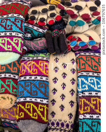 knitted woolen socks and gloves background 106797635