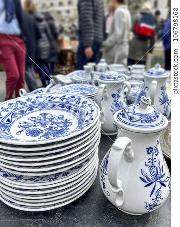 vintage porcelain plates and pot in a flea market vintage porcelain plates and pot in a flea market 106798168