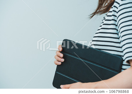 Woman working on a tablet 106798868