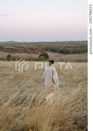 Stylish woman enjoys nature. Fashion style. People, freedom, lifestyle, travel and vacations concept Stylish woman enjoys nature. Fashion style. People, freedom, lifestyle, travel and vacations concept 106799031