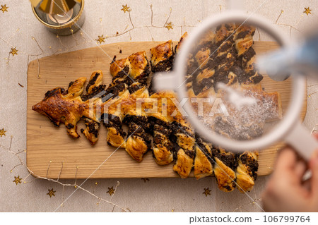 ome made poppy seed cake covering with sugar powder 106799764