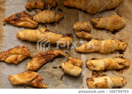 home made pastry on a baking paper in a tray home made pastry on a baking paper in a tray 106799765