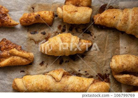 home made pastry on a baking paper in a tray home made pastry on a baking paper in a tray 106799769