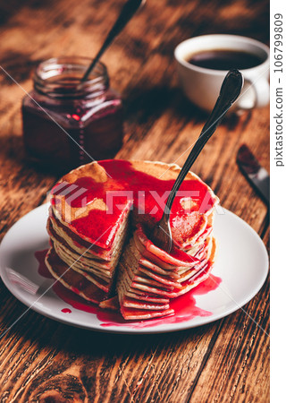 Stack of pancakes with berry fruit marmalade 106799809
