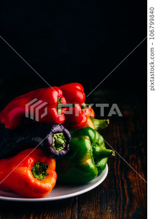 Fresh bell peppers on plate Fresh bell peppers on plate 106799840