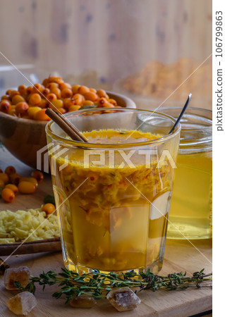 sea buckthorn honey ginger mix in glass with cinnamon sea buckthorn honey ginger mix in glass with cinnamon 106799863
