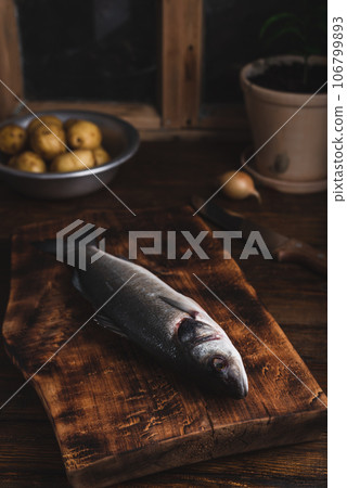 Raw Fish on Cutting Board 106799893