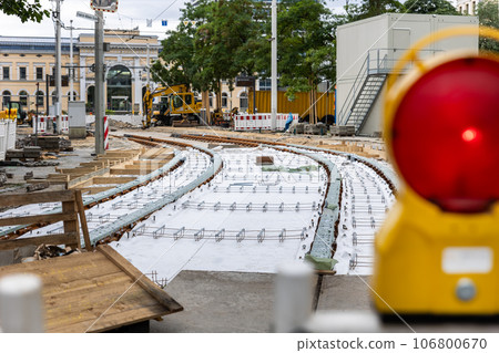 New tram rails laying on european city street. Installation modern railway tramway rails for trams. Reconstruction repairing renewal road. City infrastructure development construction site 106800670