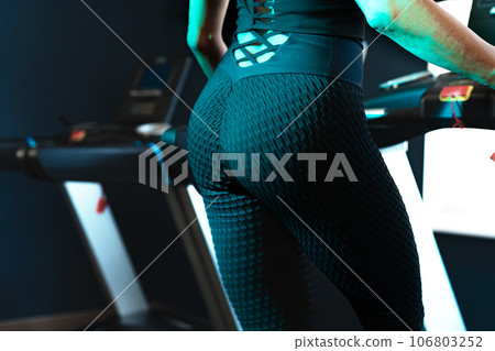 Beautiful athletic ass in black sport leggings close-up 106803252