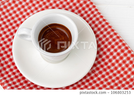 Cup of espresso coffee on saucer close up 106803253