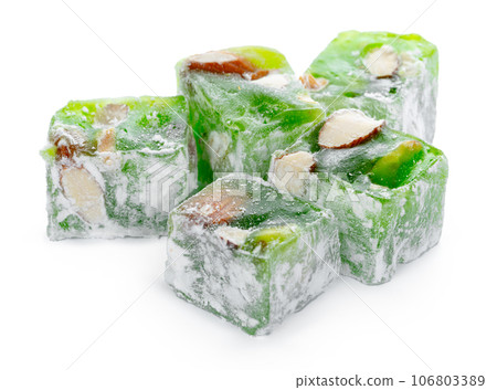 Close up of green Turkish delight sweets isolated on white Close up of green Turkish delight sweets isolated on white 106803389