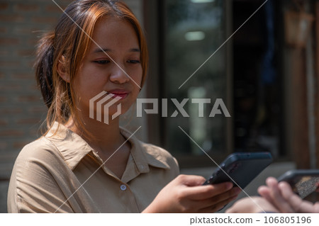 Asia customer woman scan QR code payment and pick up purchase online shopping food, Grocery man delivers service organic vegetable and fruit Asia customer woman scan QR code payment and pick up purchase online shopping food, Grocery man delivers service organic vegetable and fruit 106805196