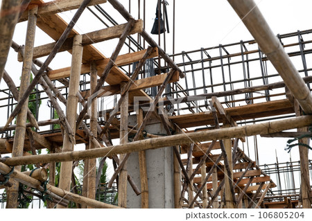 Bamboo scaffolding or crutches in traditional residential construction background Bamboo scaffolding or crutches in traditional residential construction background 106805204