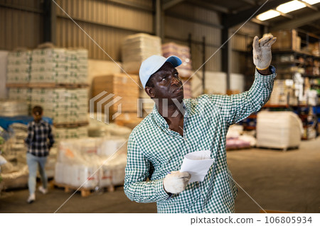 Portrait of focused African American man at hardware store Portrait of focused African American man at hardware store 106805934