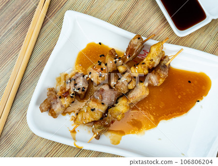 Traditional Yakitori made of chicken pieces served in a plate Traditional Yakitori made of chicken pieces served in a plate 106806204