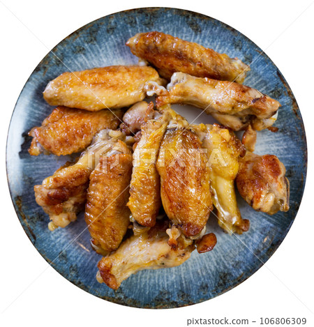 Portion of appetizing fried chicken wings Portion of appetizing fried chicken wings 106806309
