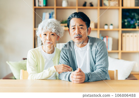 A worried senior couple A worried senior couple 106806488