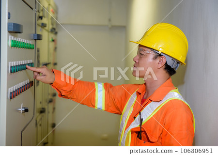 electrical engineer using tablet checking and service electrical engineer using tablet checking and service 106806951
