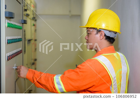 electrical engineer using tablet checking and service electrical engineer using tablet checking and service 106806952