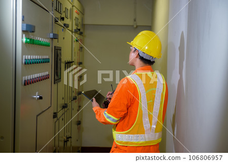 electrical engineer using tablet checking and service 106806957