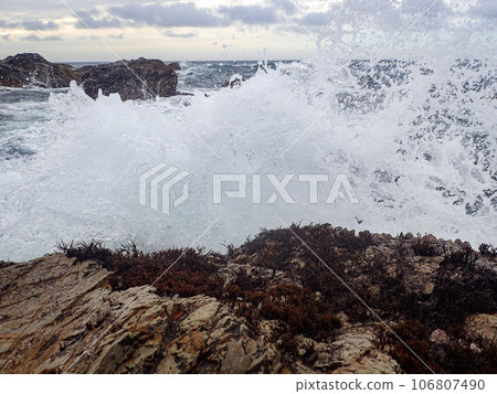 Wave splash on the rocky shore Wave splash on the rocky shore 106807490