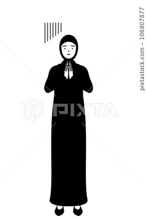 Islamic woman apologizes with her hands together in front of her body 106807877
