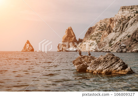 Remote beach, calm sea with volcanic rocky shores, with small waves on the water surface. The summer ocean beach, a holiday, vacation, and travel concept with a focus on natural scenery. Nobody Remote beach, calm sea with volcanic rocky shores, with small waves on the water surface. The summer ocean beach, a holiday, vacation, and travel concept with a focus on natural scenery. Nobody 106809327