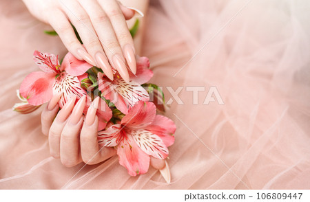 Elegant pastel pink natural manicure. Elegant pastel pink natural manicure. 106809447