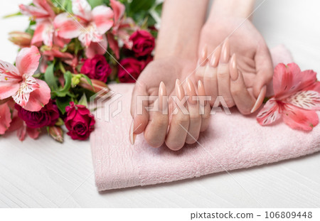 Elegant pastel pink natural manicure. Elegant pastel pink natural manicure. 106809448