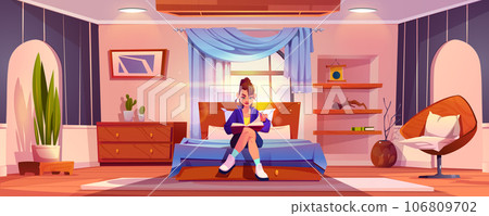 Young girl sitting on bed in bedroom reading book. Young girl sitting on bed in bedroom reading book. 106809702
