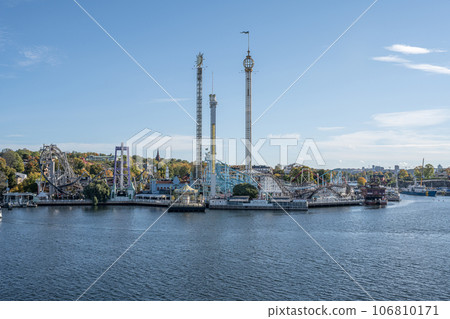 View of amusement park Grona Lund with carousels and tour rides on Djurgarden island Stockholm Sweden 106810171
