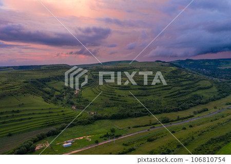 Aerial view of a storm and clouds above a village Aerial view of a storm and clouds above a village 106810754