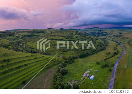 Aerial view of a storm and clouds above a village Aerial view of a storm and clouds above a village 106810832