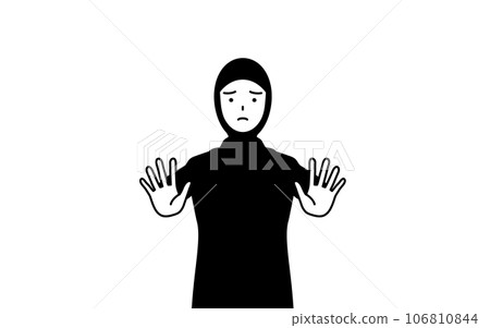 A Muslim woman who sticks out her hand in front of her body to signal a stop 106810844