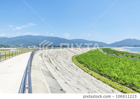 Rikuzentakata City, Iwate Prefecture: A huge seawall built as a tsunami countermeasure and Takada Matsubara planted with trees for regeneration Rikuzentakata City, Iwate Prefecture: A huge seawall built as a tsunami countermeasure and Takada Matsubara planted with trees for regeneration 106811223