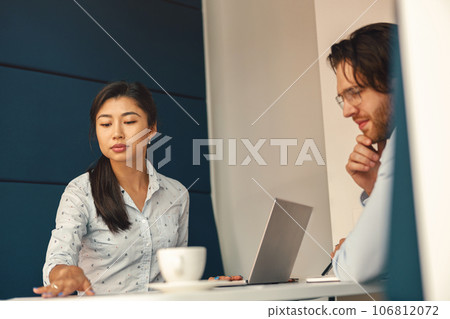 Financial analyst consult client to increase business profitability sitting in cozy coworking 106812072