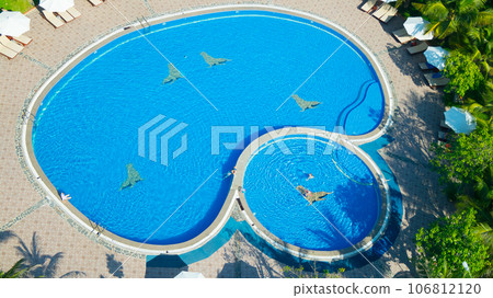 Outdoor swimming pool in the hotel.  106812120