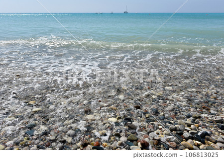 Sea waves approaching pebble stones Sea waves approaching pebble stones 106813025