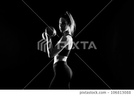 Perfect sporty female working out with dumbbells. Photo of woman in sportswear, studio Perfect sporty female working out with dumbbells. Photo of woman in sportswear, studio 106813088